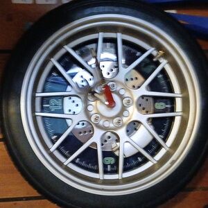 Tire clock black and silver